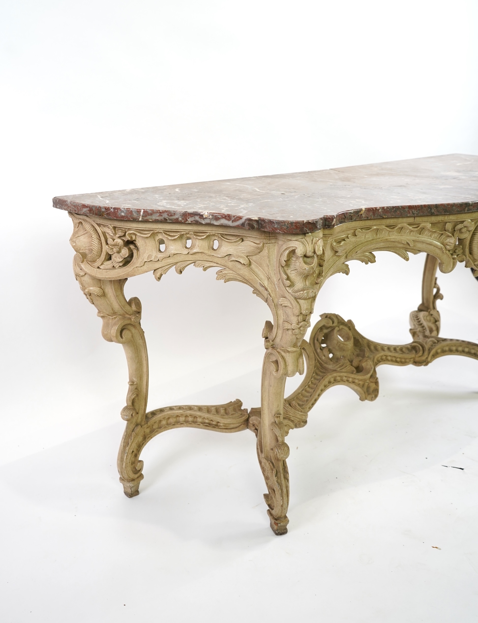 A 19th century Louis XV style marble topped painted serpentine console table